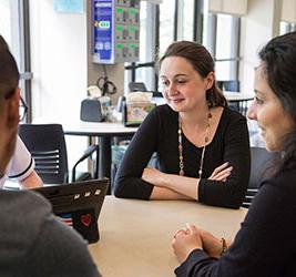 UB Students working at a table